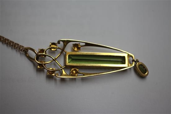 An Edwardian Art Nouveau Murrle Bennett & Co 15ct gold and peridot drop pendant, pendant 2in.